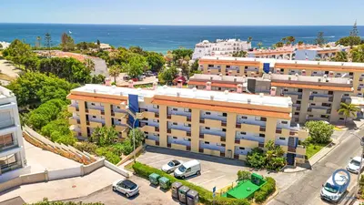 an aerial view of a building in front of the ocean at Bordalo by MTPhomes in Albufeira