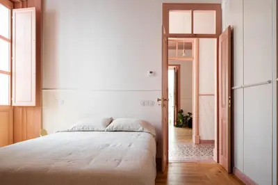 a bedroom with a large bed and a hallway at Casa 1923 by MY CHOICE in Faro