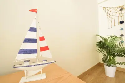 a toy boat sitting on a table next to a plant at Marina Heaven TatiHomes RC in Albufeira