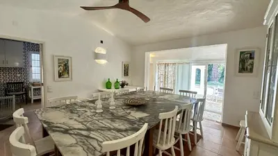 a hallway with sliding glass doors leading to a patio at Villa Morocco with Heated Private Pool for 12 Guests in Albufeira in Albufeira