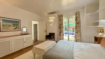 a bedroom with a bed and a desk in a room at Villa Morocco with Heated Private Pool for 12 Guests in Albufeira in Albufeira