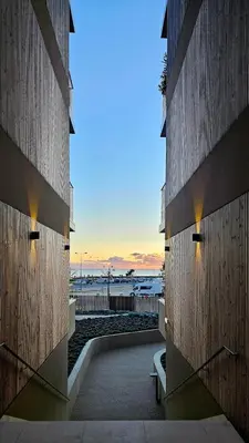 a view of the ocean from between two buildings at Sweet Horizon in Quarteira