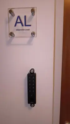 a remote control hanging on a wall with an al sign at Linda Vista in Albufeira