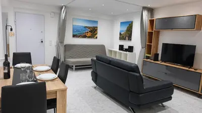 a living room with a couch and a television at Linda Vista in Albufeira