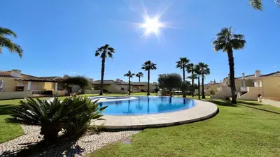 a swimming pool in a yard with palm trees at Villa Golf Gardens - Cleverdetails, Vilamoura in Vilamoura