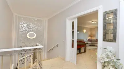 a hallway with a door leading to a living room at Villa Golf Gardens - Cleverdetails, Vilamoura in Vilamoura