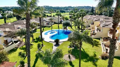 a large house with a lawn in front of it at Villa Golf Gardens - Cleverdetails, Vilamoura in Vilamoura