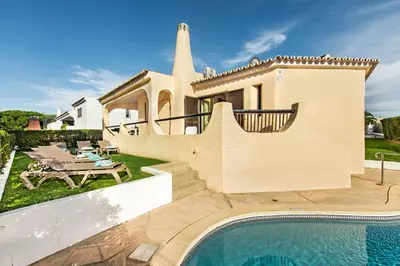 an image of a villa with a swimming pool at Pinhal View in Vilamoura