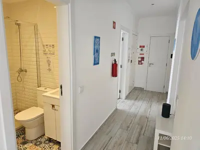 a bathroom with a toilet and a sink at Blife Farensya private apartment in Faro