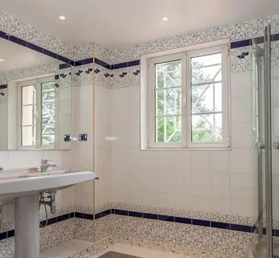 a bathroom with a sink and a shower at Stunning home with nice pool close to the beach in Loulé