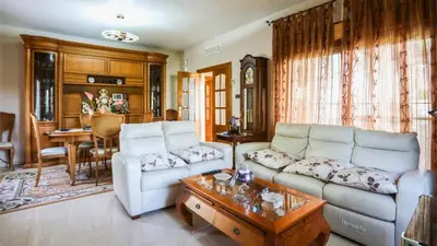 a living room with a couch and a table at Casa Donis 2021 in Albufeira
