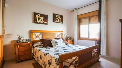 a bedroom with a bed and a window at Casa Donis 2021 in Albufeira
