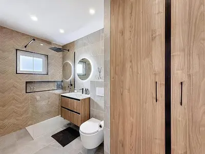 a bathroom with a toilet and a sink and a mirror at Albufeira prime stay 2 in Albufeira