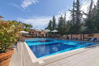 a large swimming pool with blue water in a yard at Balaia Mar 63D By MTPhomes in Albufeira