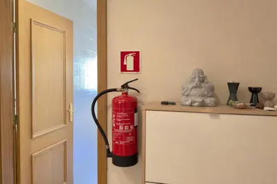 a red fire hydrant sitting on a counter in a room at Apartamento Terraços do Vale in Albufeira