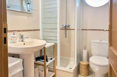 a bathroom with a shower and a sink and a toilet at Apartamento Terraços do Vale in Albufeira