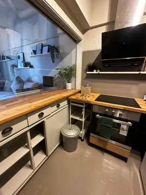 a kitchen with a counter and a stove top oven at Beach Holiday House T1 in Quarteira