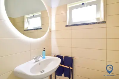 a bathroom with a sink and a mirror at Eva Andorinha 2 Pax by MTPhomes in Ferreiras