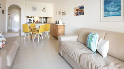 a living room with a couch and a table at Apart Palmeira Galé - Sea view - WIFI - BY BEDZY in Guia