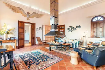 a living room with a couch and a fireplace at Vistas Algarve in Loulé