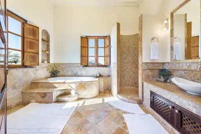a large bathroom with a tub and a sink at Vistas Algarve in Loulé