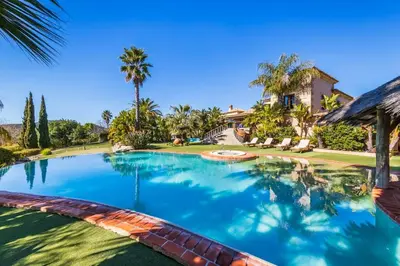 an image of a swimming pool in front of a house at Vistas Algarve in Loulé