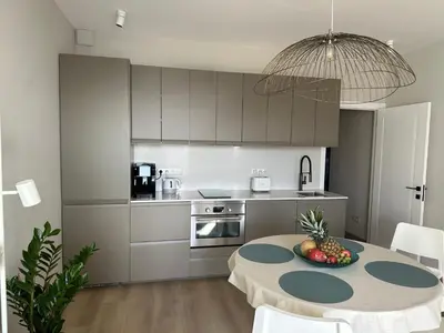 a hallway with a door and a table with a vase at BnB Homes Ocean Breeze Terrace Apartment 400 m away from the Ocean in Albufeira