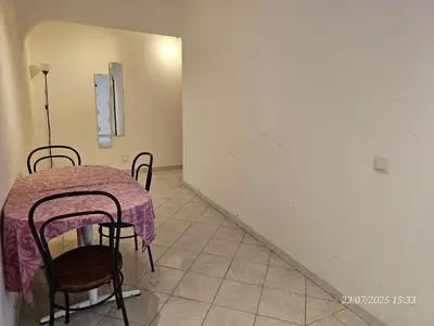 a table with a purple table cloth on it in a room at Blife Allya private apartment in FAO