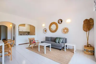 a living room with a couch and a table at Apartment Sonia in Albufeira