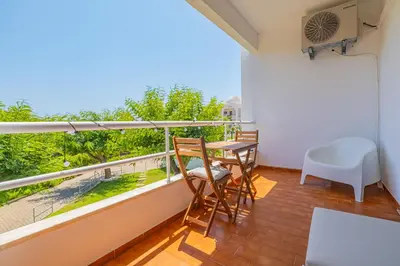 a balcony with a table and chairs and a view at Apartment Sonia in Albufeira