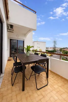 a bathroom with a toilet and a sink and a shower at Majesti Algarve Apartment in Albufeira