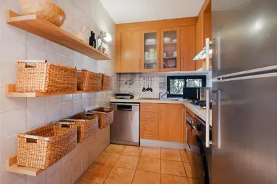 a kitchen with a stove and a dishwasher at Cozy Villa next to the Golf Course by Algarve Dream Holidays in Quarteira