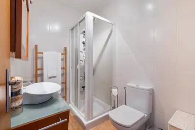 a bathroom with a shower and a toilet and a sink at Cozy Villa next to the Golf Course by Algarve Dream Holidays in Quarteira