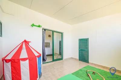 a bathroom with a shower with a glass door at Casa Joana by MTPhomes in Albufeira
