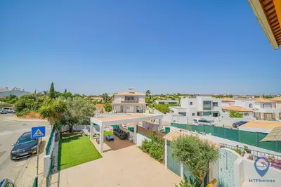 a bedroom with two beds and a window at Casa Joana by MTPhomes in Albufeira
