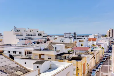 an aerial view of a city with buildings at Blife Anya private apartment in Faro