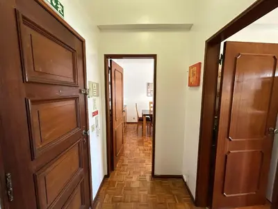 a staircase with a metal rail and marble floor at 3F Bocage - Centro de Faro in Faro