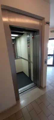 an elevator in an office building with its door open at Albufeira Apartment, Pool and Sea view in Albufeira