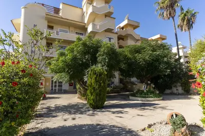 a building with trees in front of it at #344 Edificio Marina Sol by Home Holidays in Branqueira