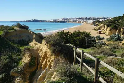 a view of a beach from a cliff at Villa Jose in Olhos de Água