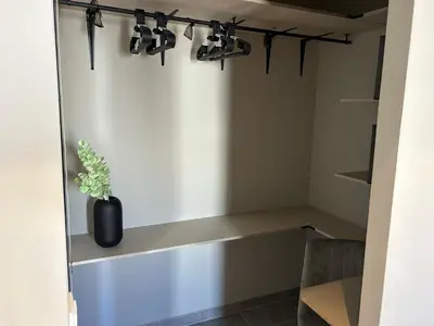 a room with a shelf with a vase and lights at Blue Coast Penthouse T4 in Quarteira
