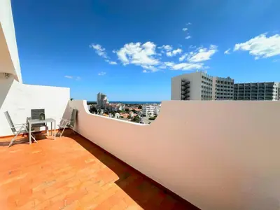 a balcony with a view of a city skyline at Apartamento Gaivotas in Albufeira