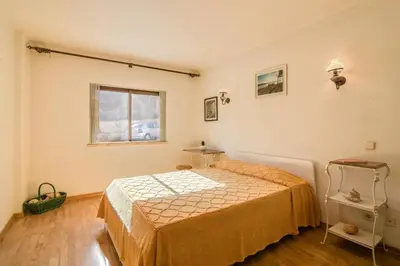 a bedroom with a bed and a window at Albufeira INN - Av Liberdade T2 in Albufeira