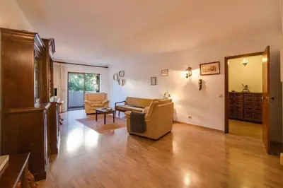 a living room with a couch and a chair at Albufeira INN - Av Liberdade T2 in Albufeira