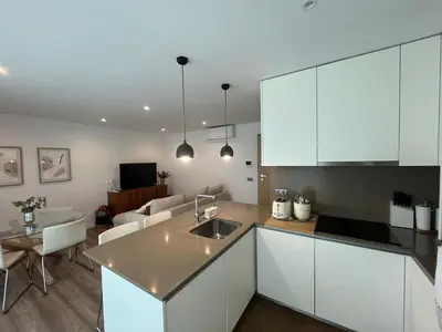 an aerial view of a city with the ocean at NEW Apartment, Sea Front & Pool in Quarteira
