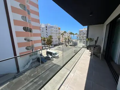an apartment balcony with a view of a city at NEW Apartment, Sea Front & Pool in Quarteira