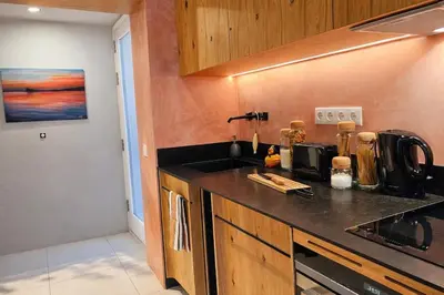 a kitchen with a sink and a counter top at Espaço Luzitano, fabulous and stylish spot, Faro city center, Wi-fi in Faro