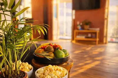 a table with a bowl of fruit on top of it at Espaço Luzitano, fabulous and stylish spot, Faro city center, Wi-fi in Faro