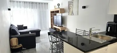 a desk with a computer sitting on a balcony at Ocean View in Albufeira