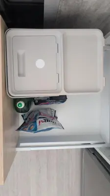 a white refrigerator with its door open and a drawer at Albufeira Spring, Summer & Fall in Albufeira